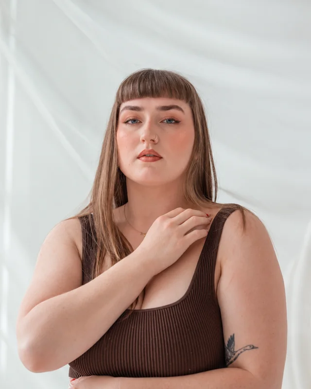 Soft peach glam makeup applied to the same stock portrait