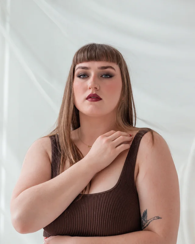 Charcoal smoky eye and berry lipstick applied to a stock portrait